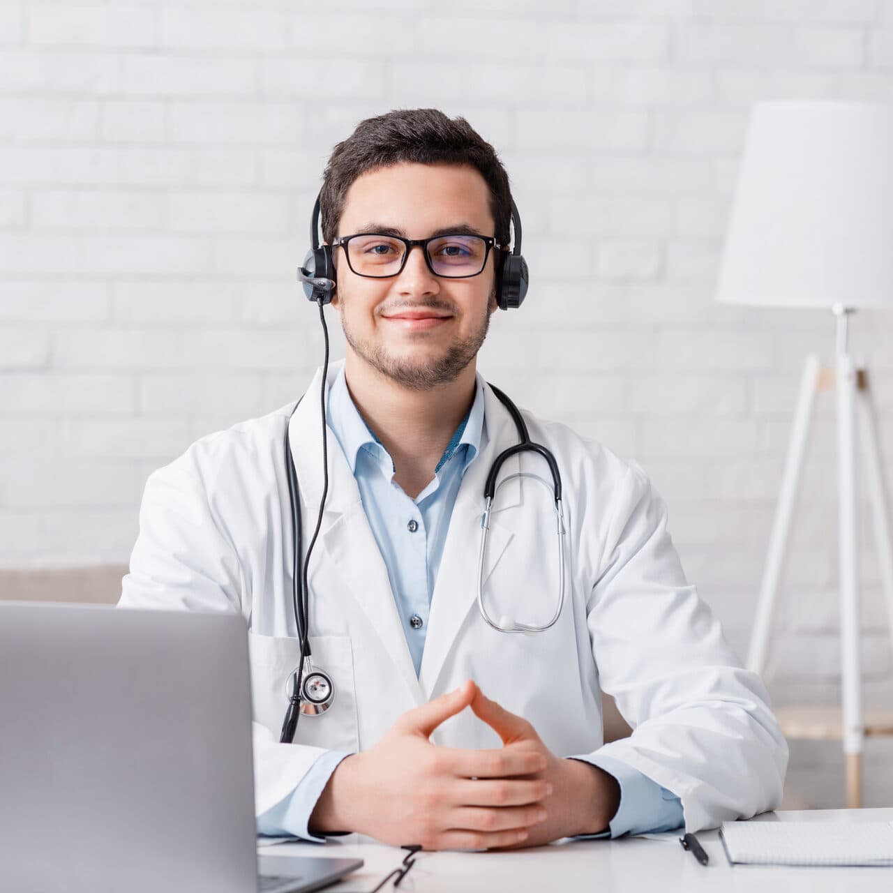 Doctor providing online telehealth consultation from a home office
